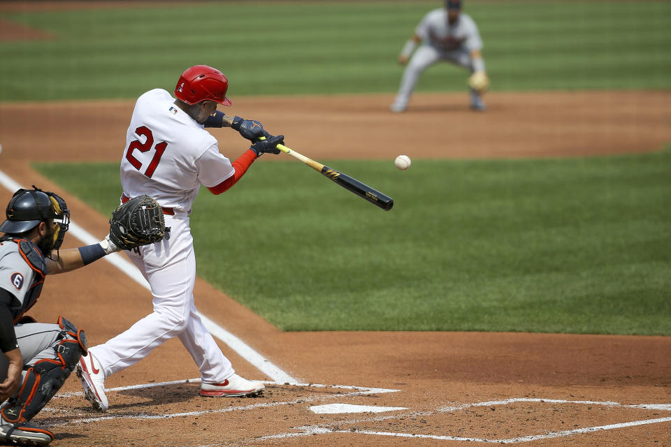 St. Louis Cardinals' Yadier Molina hits a two-run home run during the second inning in the first game of a baseball doubleheader against the Detroit Tigers Thursday, Sept. 10, 2020, in St. Louis. Molina is wearing the number 21 in honor of Roberto Clemente. (AP Photo/Scott Kane)