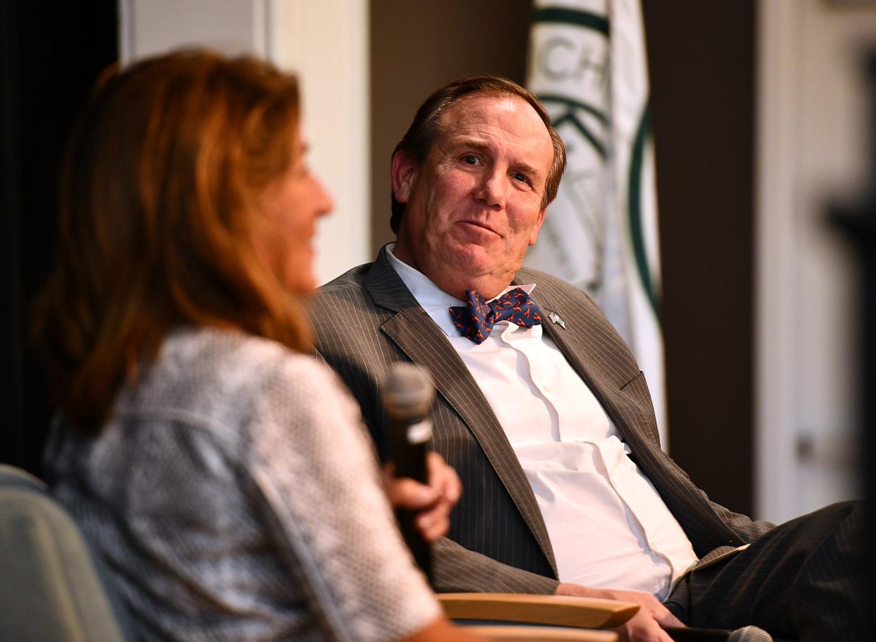 Nichols College president Glenn M. Sulmasy has a conversation with former Lt. Gov. Karyn Polito during a campus event in April.