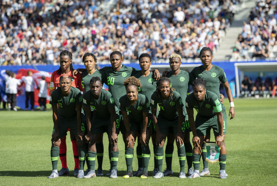 GRENOBLE, FRANCE - JUNE 22: Team of Nigeria poses for a group photo during the 2019 FIFA Women's World Cup France Round Of 16 match between Germany and Nigeria at Stade des Alpes on June 22, 2019 in Grenoble, France. (Photo by Maja Hitij/Getty Images)