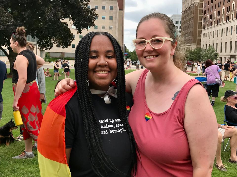 Alex Wooster and stepmom Angie Wooster of Williamston pose for a portrait outside the Michigan State Capitol building before the 2022 Michigan Pride Rally on June 26, 2022.