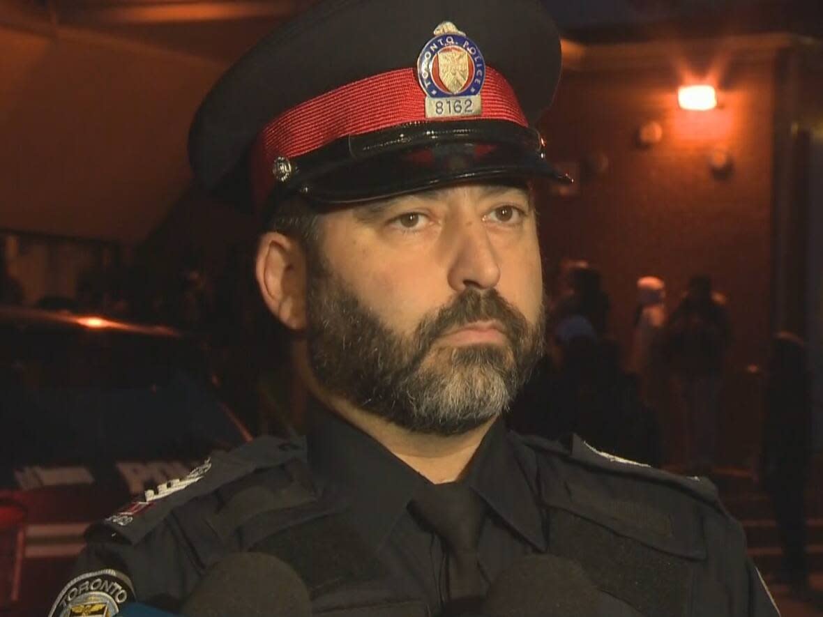 Duty Insp. Jason Albanese, spokesperson for the Toronto Police Service, speaks to reporters near Lakeshore Collegiate Institute following a report of a person with a knife in the immediate area. (CBC - image credit)