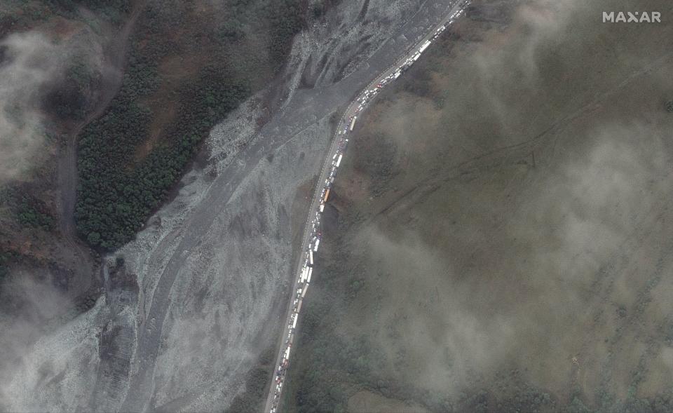 Trucks and cars wait in a traffic jam near Russia's border with Georgia on Sept. 25, 2022.