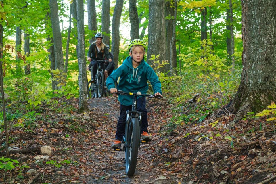 Bikers enjoy the trails at the Tanton Family Working Forest Reserve, designed by Rock Solid Contracting, LLC.