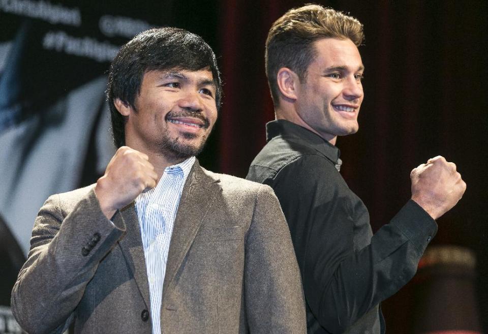 Boxers Manny Pacquiao, left, and Chris Algieri pose for a photo in Los Angeles, Wednesday, Sept. 3, 2014. They will fight for Pacquiao&#39;s WBO welterweight title at The Venetian Macao hotel on Nov. 22. (AP Photo/Damian Dovarganes)