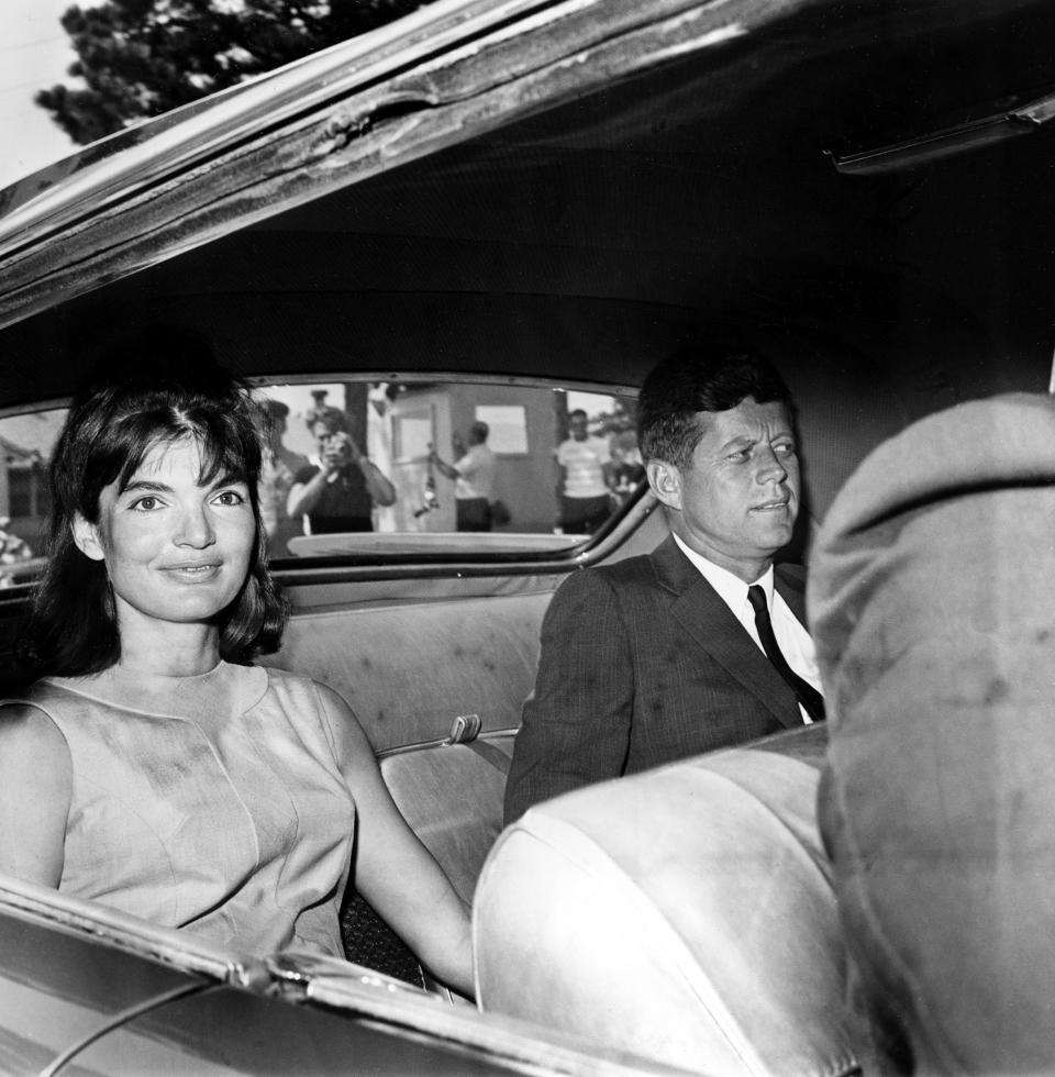 Jacqueline Kennedy and U.S. President John F. Kennedy are shown in the backseat of a car as they leave Otis Air Force Base Hospital, Ma., Aug. 14, 1963.  One week ago, the first lady gave birth to their premature son, Patrick Bouvier Kennedy, who died two days later.  (AP Photo)