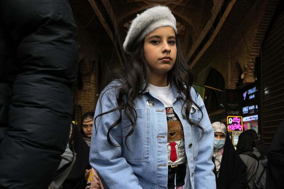 A girl walks through the old main bazaar of Tehran, Iran, Saturday, March 2, 2024. A day after parliamentary election concluded in Iran, hard-liners are leading in initial vote counting in the capital of Tehran, state media reported Saturday. (AP Photo/Vahid Salemi)