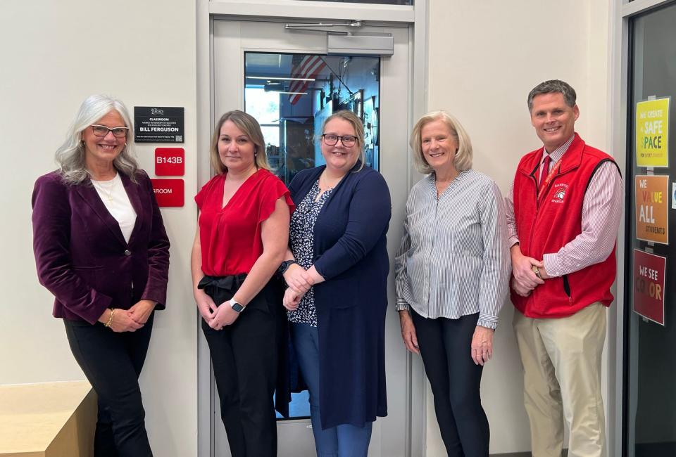 The new Bill Ferguson English classroom at Sanford High School, as shown by Laurie Ferguson, Sanford High School Principal Amanda Doyle, English teacher Liz White, Sanford Schools Legacy Foundation President Kendra Williams and Superintendent Matthew Nelson.