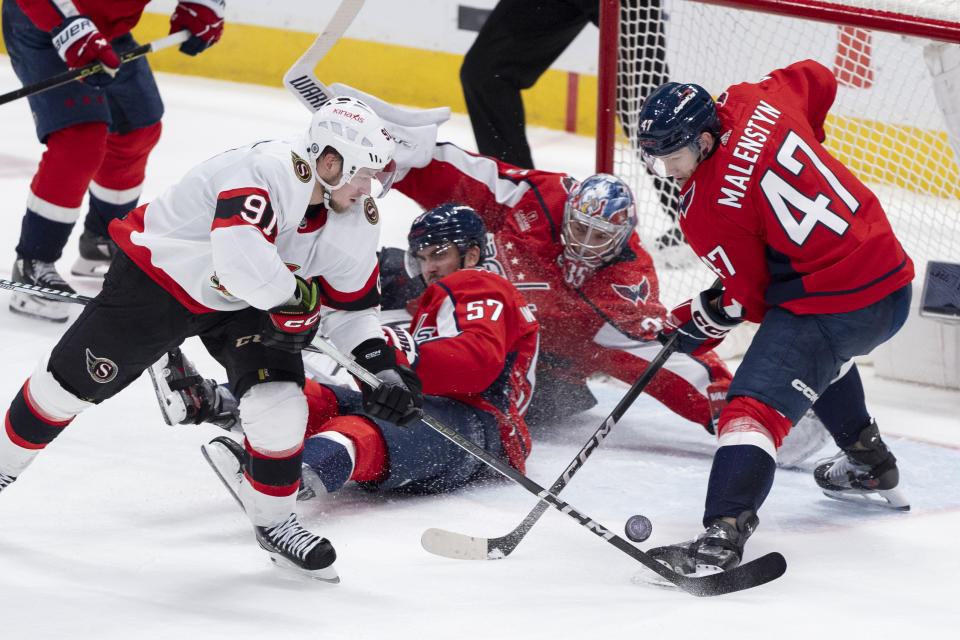 Washington Capitals defenseman Trevor van Riemsdyk (57), goaltender Darcy Kuemper (35) and left wing Beck Malenstyn (47) form their defense against an attack by Ottawa Senators right wing Vladimir Tarasenko (91) during the third period of an NHL hockey game, Monday, Feb. 26, 2024, in Washington. (AP Photo/Manuel Balce Ceneta)