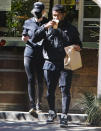 <p>Usher gets food to go as he makes his way to the park with a friend on Monday morning in Los Feliz, California.</p>