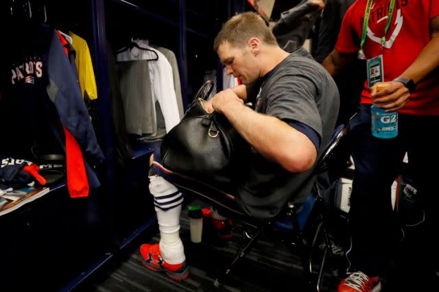 Brady searches for his jersey. Pic: Getty