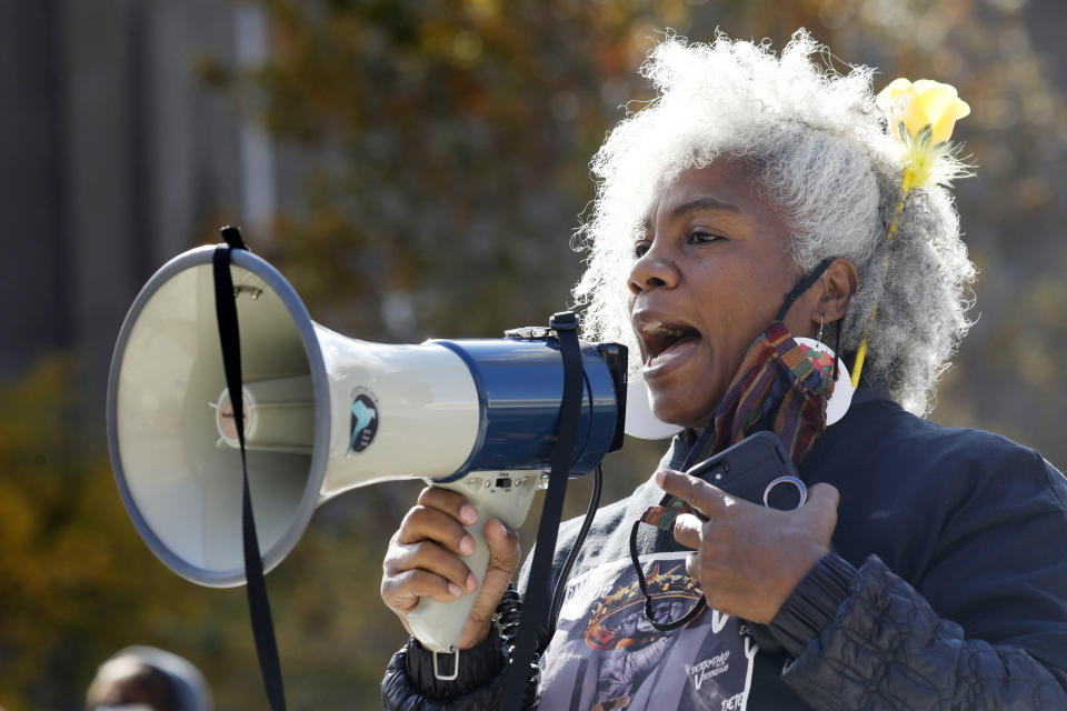 Activist Cariol Horne speaks during the WNY Women's March hosted by the WNY Peace Center in Niagara Square, Saturday, Oct. 17, 2020 in Buffalo, N.Y. Horne, a Buffalo police officer who was fired for trying to stop another officer from using a chokehold on a handcuffed suspect, has won a years-long legal fight to collect her pension on Tuesday, April 13, 2021. A state Supreme Court judge cited the changing landscape around the use of force by police and a recently passed "duty to intervene" statute adopted by the city. (Derek Gee/The Buffalo News via AP)