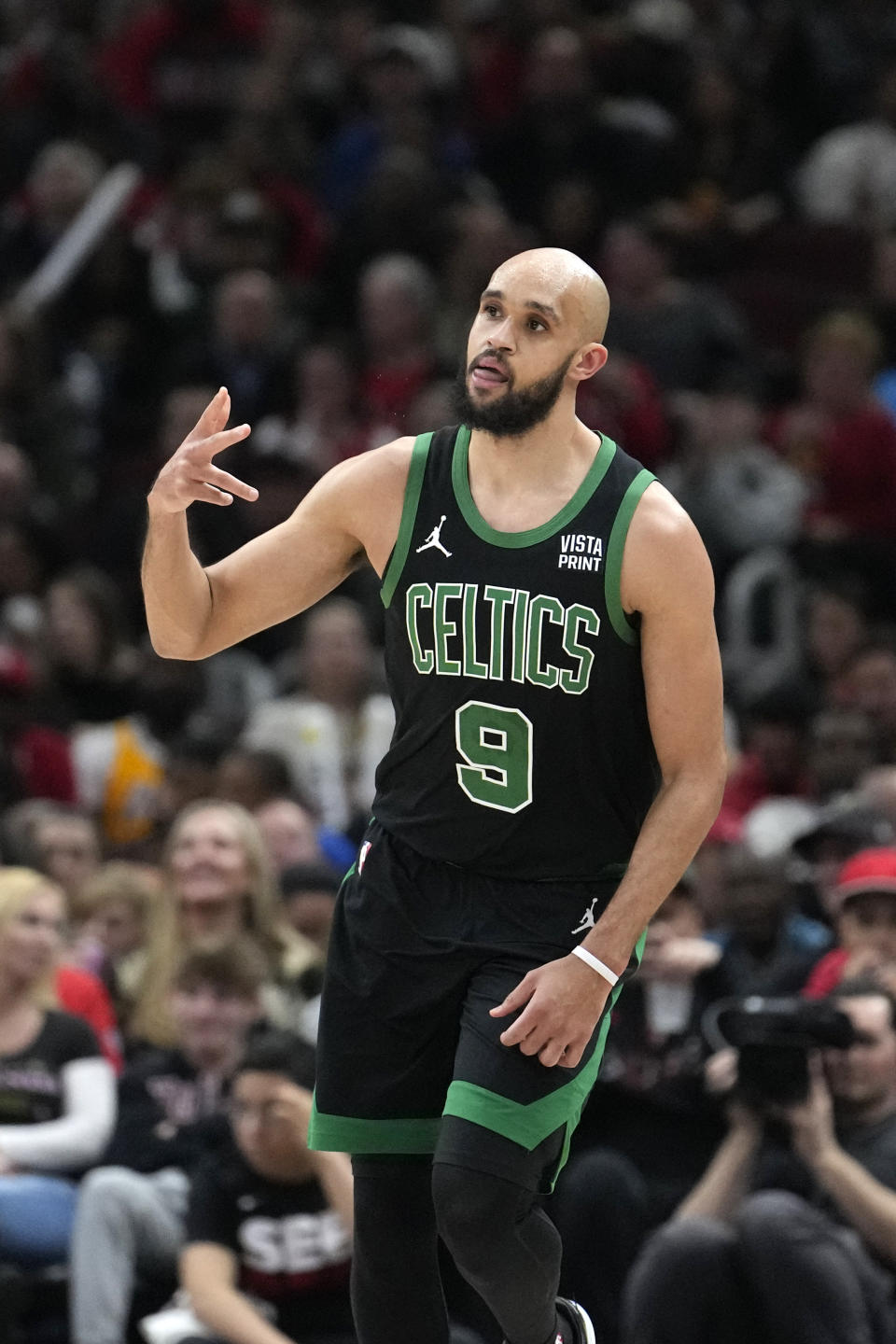 Boston Celtics' Derrick White celebrates after his 3-point basket during the second half of an NBA basketball game against the Chicago Bulls, Thursday, Feb. 22, 2024, in Chicago. (AP Photo/Charles Rex Arbogast)