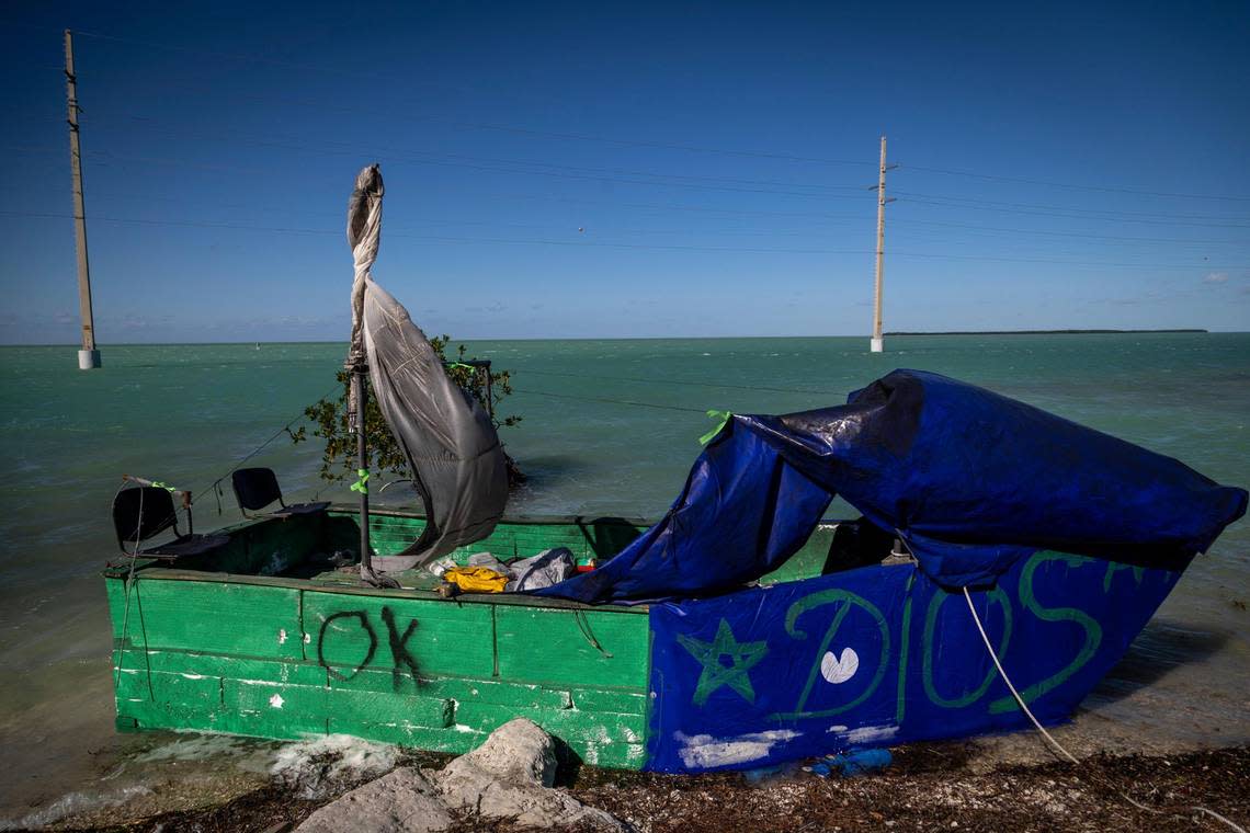 A homemade boat used by Cuban migrants to reach the United States sits offshore near the Triangle of History marker in Islamorada on the Overseas Highway, mile marker 79, on Jan. 14, 2023.