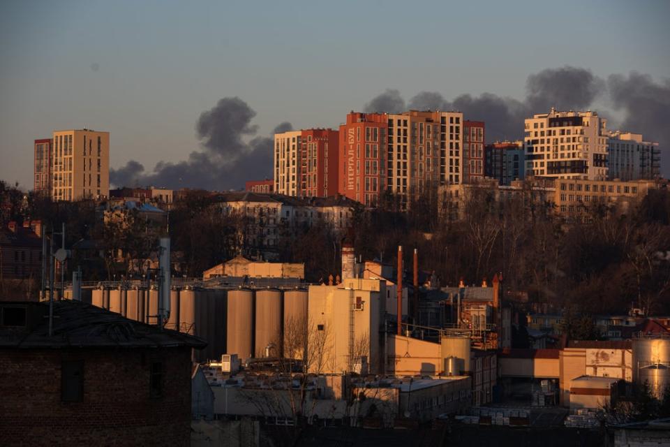 Smoke is seen above apartment blocks in Lviv (Getty Images)