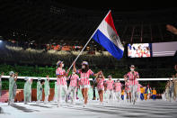 <p>TOKYO, JAPAN - JULY 23: Flag bearers Veronica Cepede Royg and Fabrizio Zanotti of Team Paraguay during the Opening Ceremony of the Tokyo 2020 Olympic Games at Olympic Stadium on July 23, 2021 in Tokyo, Japan. (Photo by Matthias Hangst/Getty Images)</p> 