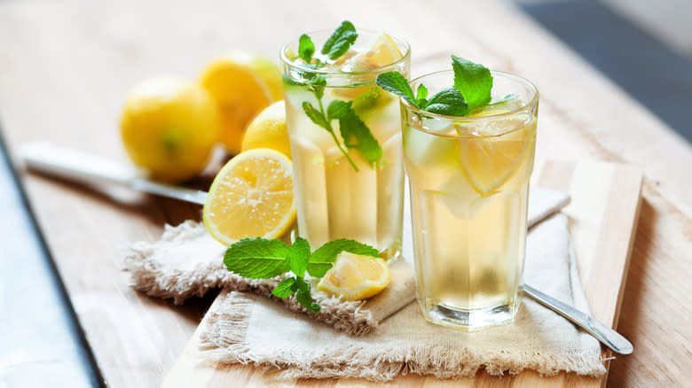 Two glasses of bourbon lemonade with fresh mint