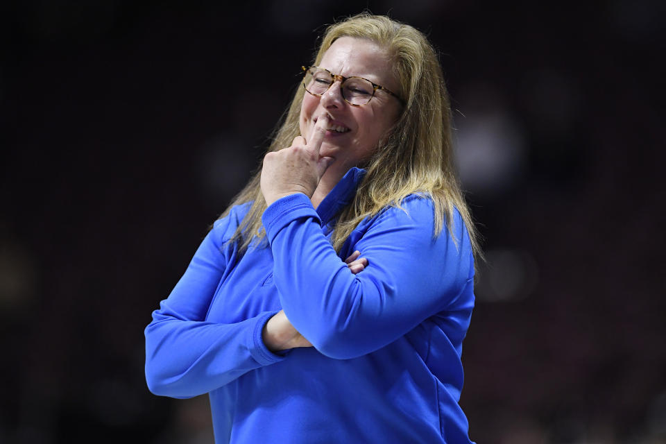 UCLA head coach Cori Close smiles in the first half of an NCAA college basketball game against Florida State, Sunday, Dec. 10, 2023, in Uncasville, Conn. (AP Photo/Jessica Hill)