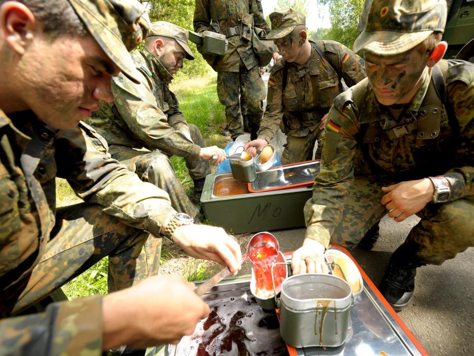 German volunteer soldiers eating during training.