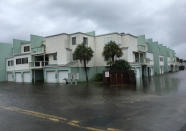 <p>Floodwaters surround a condo in the aftermath of Tropical Storm Nate on Sunday Oct. 8, 2017, in Pensacola Beach. (Photo: Brendan Farrington/AP) </p>