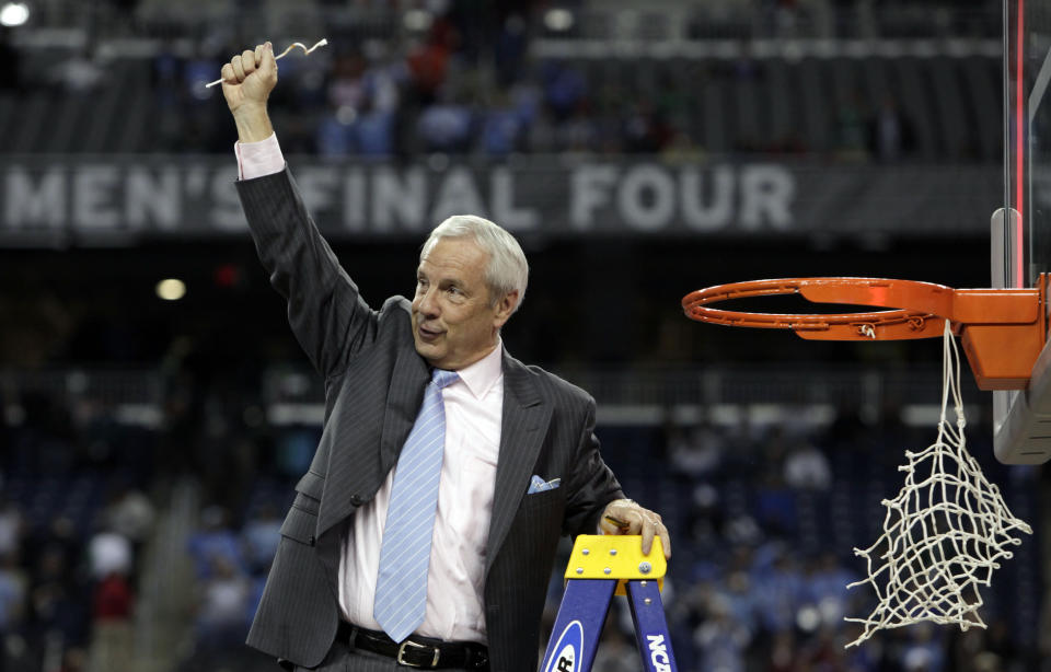 FILE - North Carolina head coach Roy Williams celebrates after his team's 89-72 victory over Michigan State in the championship game at the men's NCAA Final Four college basketball tournament in Detroit, in this Tuesday, April 7, 2009, file photo. North Carolina announced Thursday, April 1, 2021, that Hall of Fame basketball coach Roy Williams is retiring after a 33-year career that includes three national championships. (AP Photo/Paul Sancya, File)