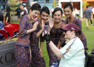 Singapore Airlines crew interacting with a fan. (PHOTO: Singapore GP)