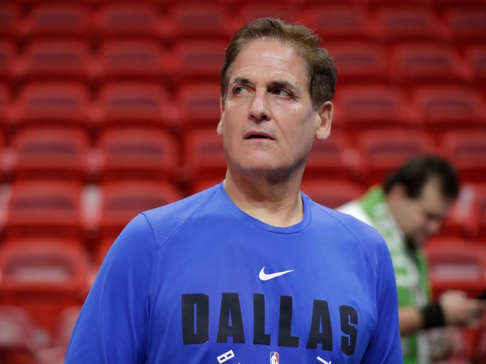 Dallas Mavericks owner Mark Cuban watches players warm up before the start of an NBA basketball game against the Miami Heat, Friday, Feb. 28, 2020, in Miami.