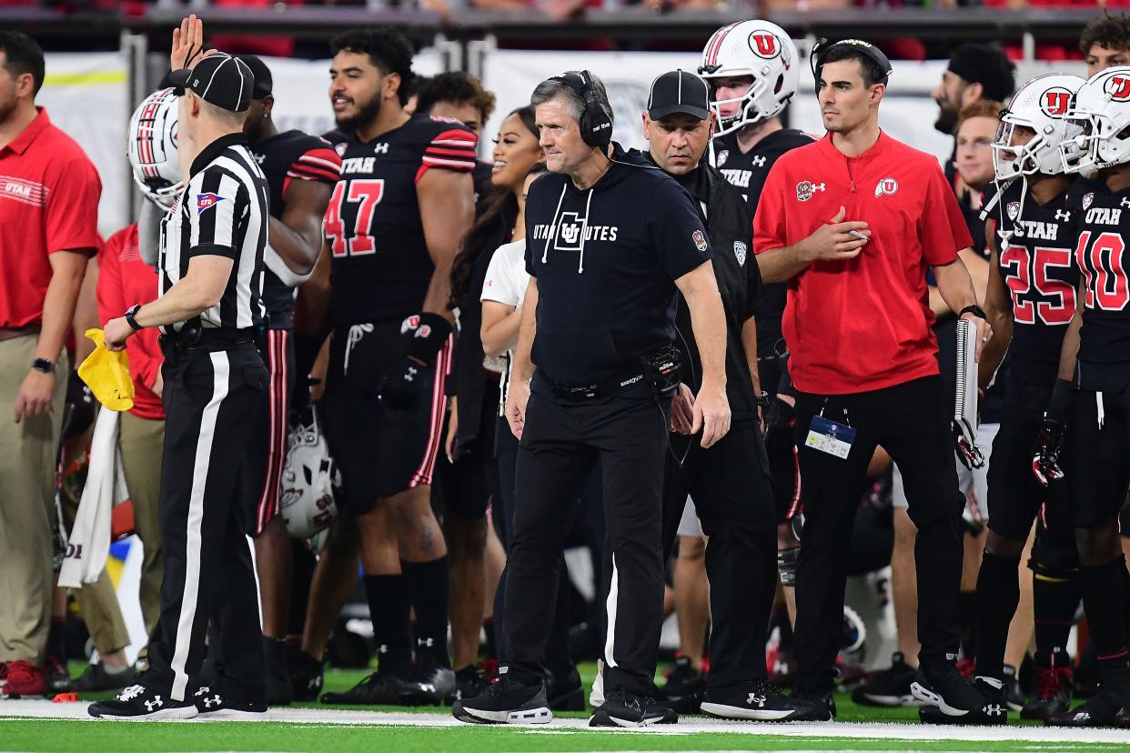 Utah coach Kyle Whittingham, center, looks on during the Utes' win over Oregon on Friday in the Pac-12 championship game.