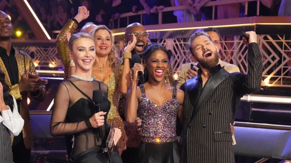 Charity Lawson (center) celebrates earning a perfect score for her redemption tango on the Season 32 finale of "Dancing With the Stars"