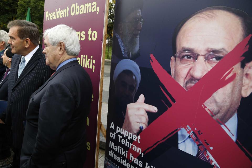 U.S. politicians Ridge and Gingrich rally with supporters of Iranian opposition group Mujahedin-e Khalq as they protest against Iraq's PM Maliki before he is scheduled to meet with U.S. President Obama, outside White House in Washington