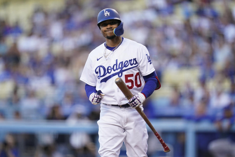 Los Angeles Dodgers' Mookie Betts (50) reacts after striking out during the first inning of a baseball game against the Chicago Cubs in Los Angeles, Friday, July 8, 2022. (AP Photo/Ashley Landis)
