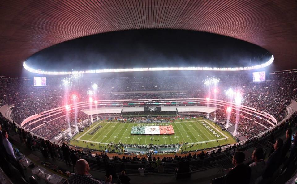 Nov 21, 2016; Mexico City, MEX; General overall view of a Mexican flag on the field and fireworks during the playing of the Mexico national anthem before a NFL International Series game between the Houston Texans and the Oakland Raiders at Estadio Azteca. Mandatory Credit: Kirby Lee-USA TODAY Sports