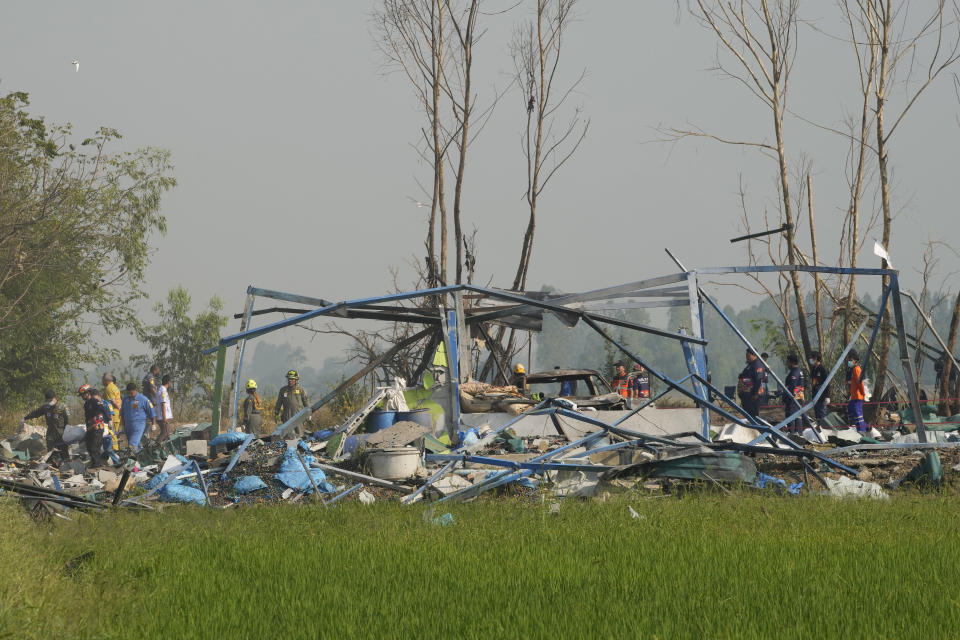 Thai rescue workers carry the body of a victim from the site of an explosion at a fireworks factory in Suphan Buri province, Thailand, Thursday, Jan. 18, 2024. The blast in central Thailand killed multiple people on Wednesday, according to provincial officials, though the devastation at the scene has made the death toll uncertain. (AP Photo/Sakchai Lalit)