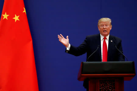 FILE PHOTO: U.S. President Donald Trump delivers his speech as he and China's President Xi Jinping meet business leaders at the Great Hall of the People in Beijing, China, November 9, 2017. REUTERS/Damir Sagolj/File Photo