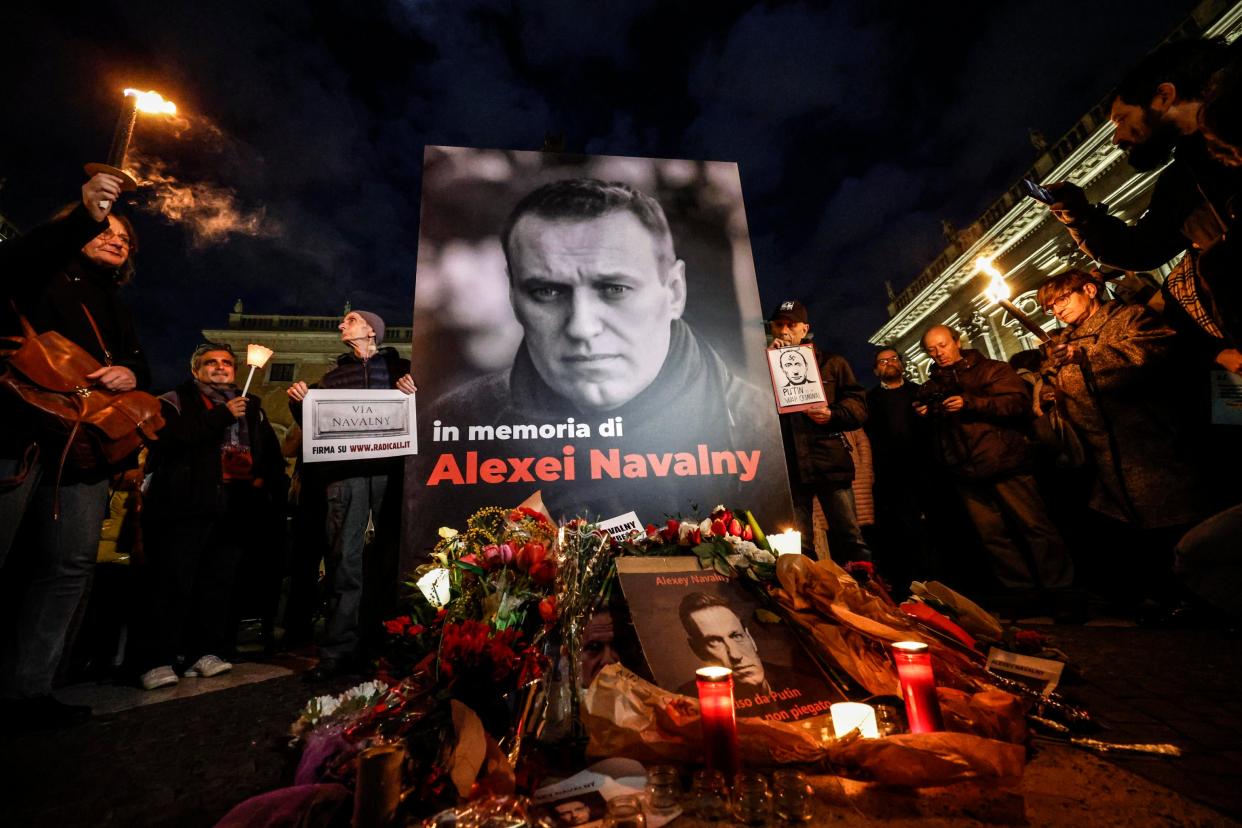 People attend a torchlight procession in memory of Russian opposition leader Alexei Navalny, who died on 16 February in a Arctic penal colony, the Federal Penitentiary Service of the Yamalo-Nenets Autonomous District, in Rome, Italy, 19 February 2024 (EPA)