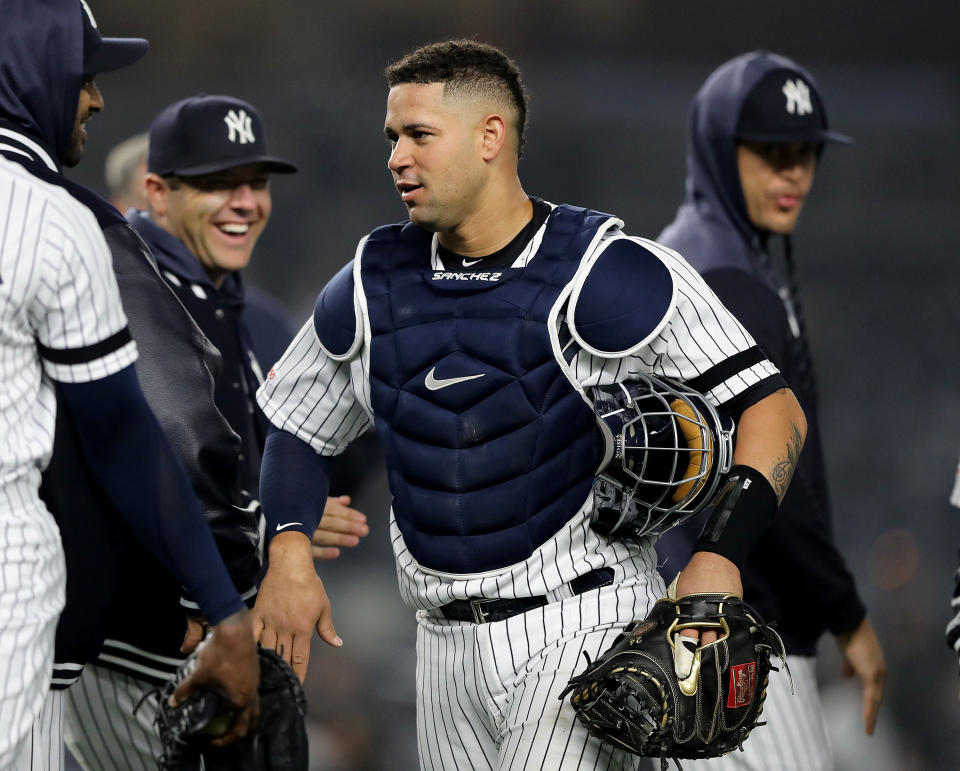 NEW YORK, NEW YORK - MAY 03:  Gary Sanchez #24 of the New York Yankees celebrates the win with teammates after the game against the Minnesota Twins at Yankee Stadium on May 03, 2019 in the Bronx borough of New York City.The New York Yankees defeated the Minnesota Twins 6-3. (Photo by Elsa/Getty Images)