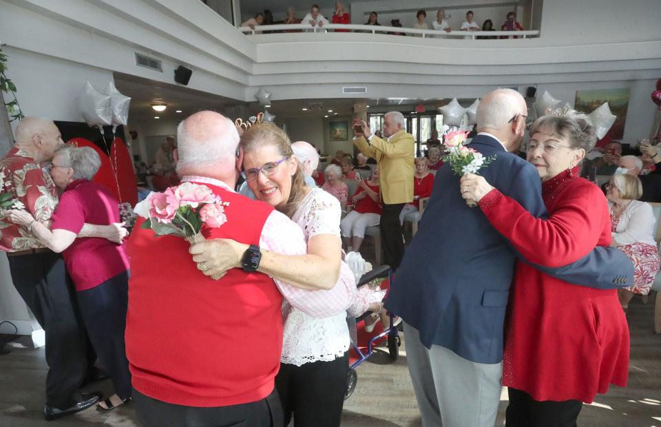 Valentine's Day wedding couples have a first dance after renewing their marriage vows at CountySide Lakes Senior Living in Port Orange.