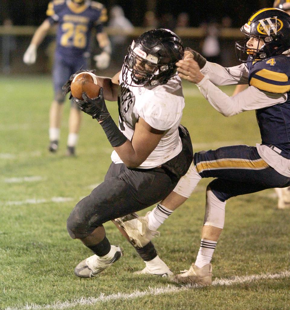 Chris Jackson hauls in a pass for White Pigeon during the fourth quarter of the Chiefs' regional finals matchup with Ottawa Lake Whiteford on Friday night.