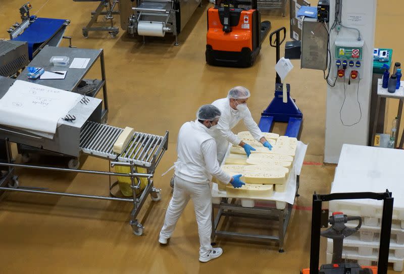 Employees work at Madeta dairy factory in Plana nad Luznici