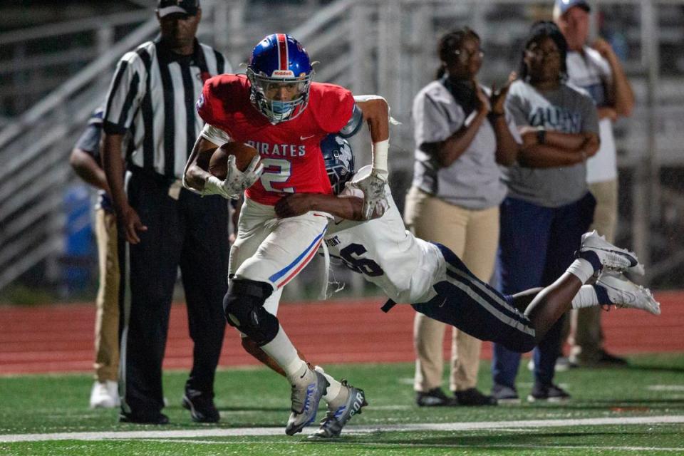 Pass Christian’s Jacquez Alexander-Dedeaux gets tackled during a game against Moss Point at Pass Christian High School in Pass Christian on Friday, Oct. 13, 2023.