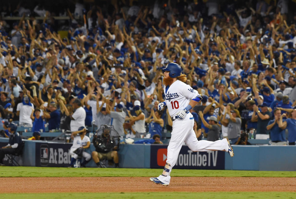 <p>Los Angeles Dodgers third baseman Justin Turner rounds the bases after hitting a two-run home run against the Houston Astros in the sixth inning in game one of the 2017 World Series at Dodger Stadium. Mandatory Credit: Jayne Kamin-Oncea-USA TODAY Sports </p>