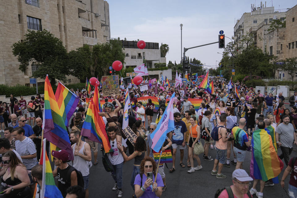 Participants march in the annual Pride parade in Jerusalem, Thursday, June 1, 2023. Thousands of people march in Jerusalem's Pride parade on Thursday, an annual event that is taking place this year under Israel's most right-wing government ever, stacked with openly homophobic members. (AP Photo/Ohad Zwigenberg)