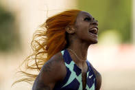 Sha'Carri Richardson celebrates after winning the fourth heat during the women's 100-meter run at the U.S. Olympic Track and Field Trials Friday, June 18, 2021, in Eugene, Ore. (AP Photo/Ashley Landis)