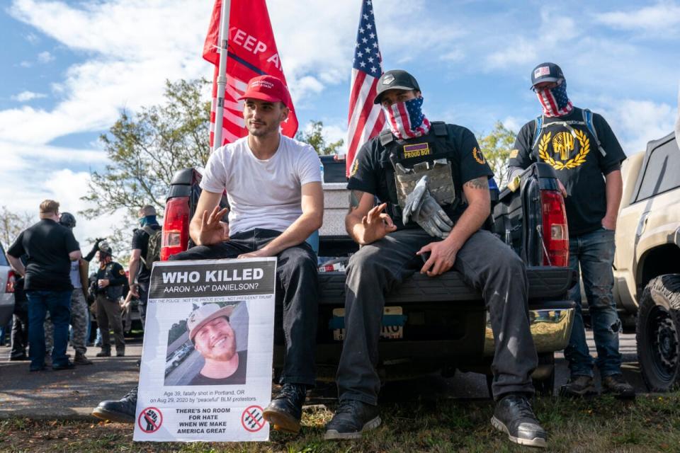 Proud Boys flash the OK hand signal, a gesture often associated with far-right groups, during Proud Boy rally on September 26, 2020 in Portland, Oregon. (Photo by Nathan Howard/Getty Images)