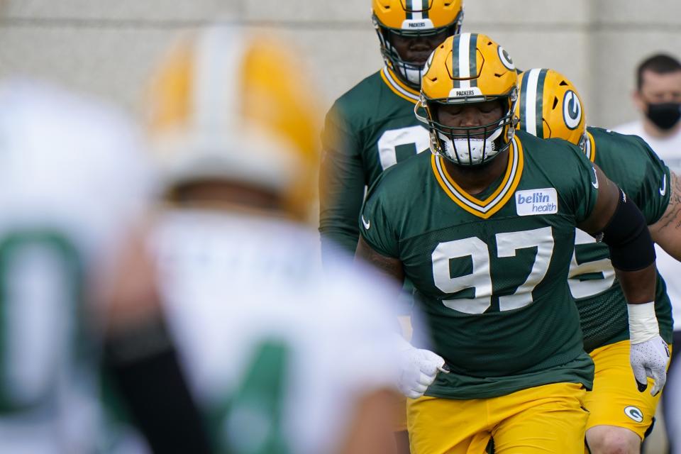 Green Bay Packers' Kenny Clark runs a drill during NFL football training camp Saturday, Aug. 15, 2020, in Green Bay, Wis. (AP Photo/Morry Gash)