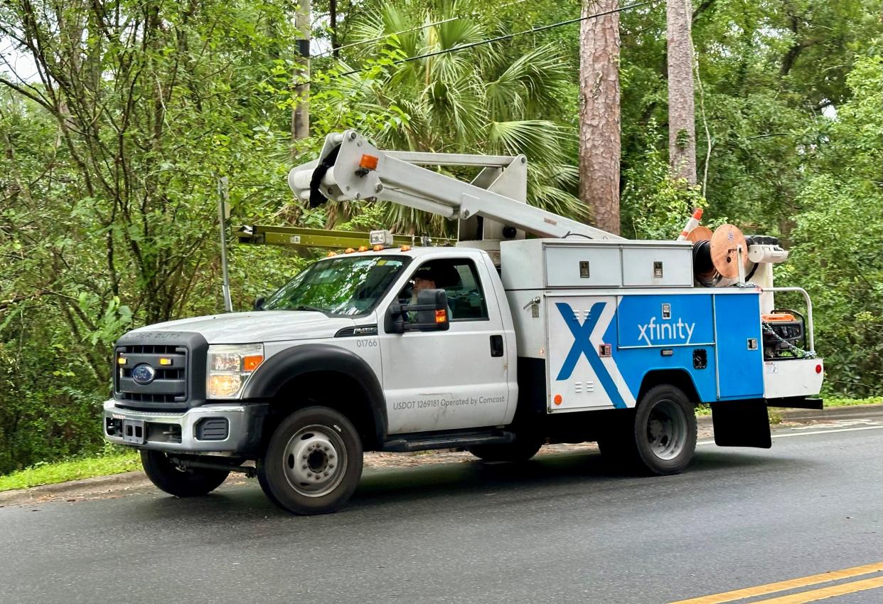Comcast trucks and personnel worked to restore service Friday, May 17, 2024, in Indianhead Acres, which was heavily damaged in the May 10 tornado outbreak.