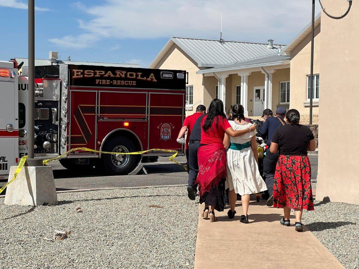 First responders arrive at the scene of the Albuquerque shooting. (AP)