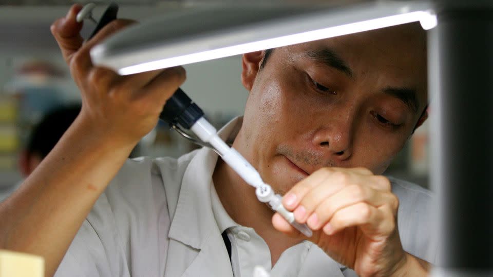 A Chinese scientist works at a medical genetics laboratory  at the Central South University in Changsha, China, in 2006. - Guang Niu/Getty Images