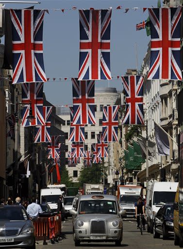 British Union flags fly above New Bond Street in London, Friday, May 25, 2012. The capital is preparing to celebrate the Diamond Jubilee, marking the Queen's 60 year reign. (AP Photo/Kirsty Wigglesworth)