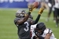 Louisville defensive back Isaiah Hayes (33) breaks up a pass to Pittsburgh wide receiver Jordan Addison (3) during the second half of an NCAA college football game, Saturday, Sept. 26, 2020, in Pittsburgh. Pittsburgh won 23-20. (AP Photo/Keith Srakocic)