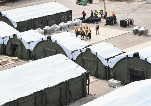 Construction workers set up a makeshift hospital at Sunnybrook Hospital in Toronto back on March 11, 2021. 